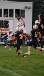 Micah Dexter leaps to haul in a long pass from Tate Schmaderer